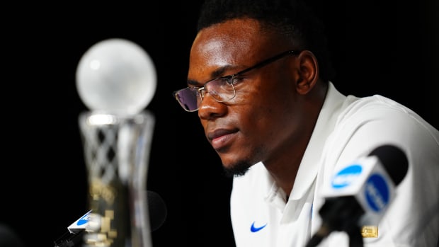 Oscar Tshiebwe decided to stay on at Kentucky rather than jump to the NBA because of the opportunity to earn NIL dollars.